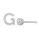 A Pavé Monogram Earring Set in the letter G in white gold on a white background.