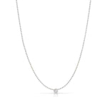 A Single Diamond Layering Necklace in white gold on a white background. 