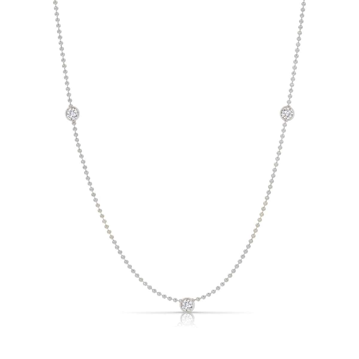 Triple Diamond Layering Necklace in white gold on a white background. 
