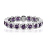 The Violet Bouquet Ring in white gold on a white background. 