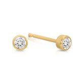A pair of Birthstone Studs - Diamond (April) in yellow gold on a white background.