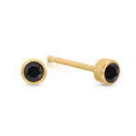 A pair of Birthstone Studs - Onyx (August) in yellow gold on a white background.