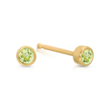 A pair of Birthstone Studs - Peridot (August) in yellow gold on a white background.