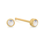 A pair of Birthstone Studs - Moonstone (June) in yellow gold on a white background.