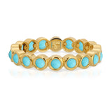 The Bluebell Bouquet Ring in yellow gold on a white background. 