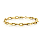 A Bold Link Bracelet in yellow gold on a white background. 