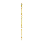 A Stardust Earring in yellow gold on a white background. 