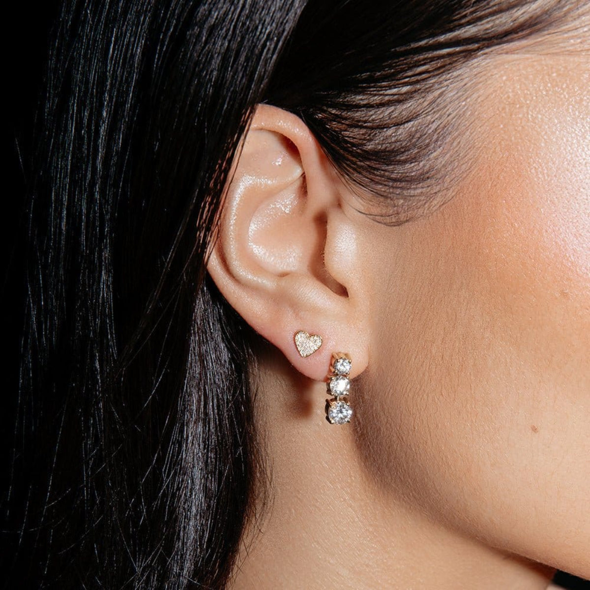 Triple Sec Diamond Earring and Pave Charm Stud - Heart shown on a brunette woman's ear. 