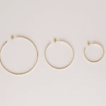 Sleek & Chic Hoops in small, medium and large against an off-white background.  