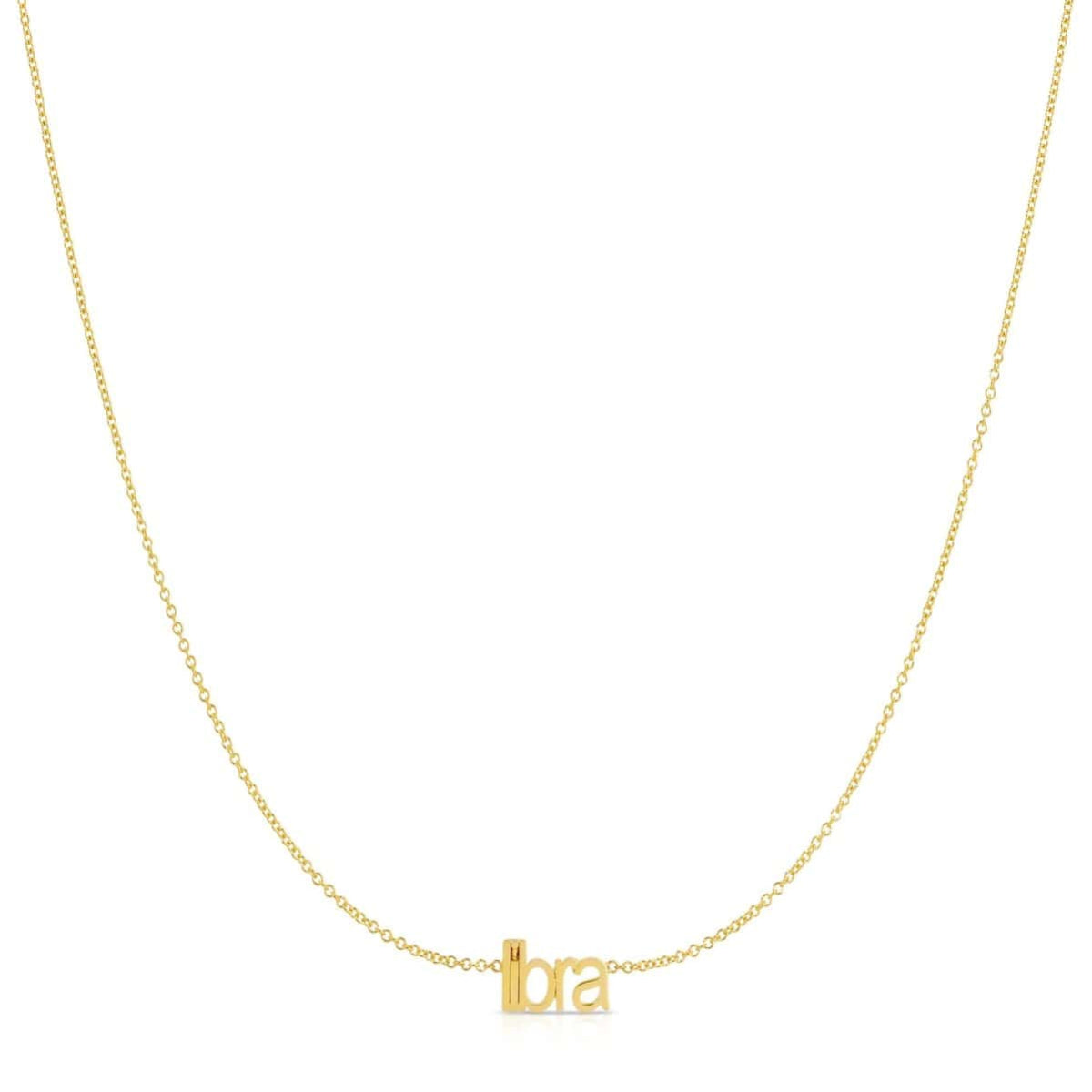 Petite Zodiac Necklace ‘libra’ in yellow gold on a white background.