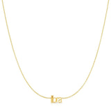 Petite Zodiac Necklace ‘libra’ in yellow gold on a white background.
