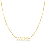 A Madre Necklace in yellow gold on a bead chain on a white background.
