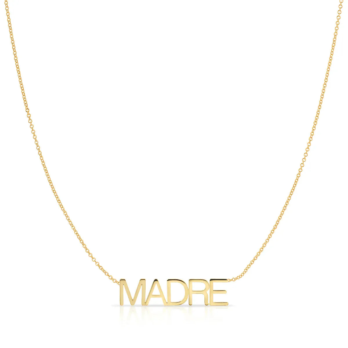 A Madre Necklace in yellow gold on a cable chain on a white background.