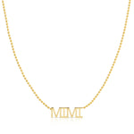 A MIMI Necklace in yellow gold on a bead chain on a white background.