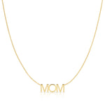 A MOM Necklace in yellow gold on a cable chain on a white background. 