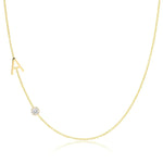 Gold necklace with a small diamond pendant on a white background