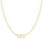 A MRS Necklace in yellow gold on a bead chain on a white background. 