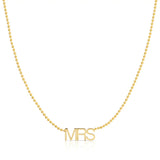 A MRS Necklace in yellow gold on a bead chain on a white background. 