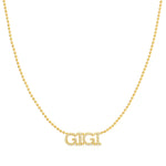 A Pavé 'GIGI' Necklace in yellow gold on a bead chain on a white background.