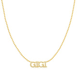 A Pavé 'GIGI' Necklace in yellow gold on a bead chain on a white background.