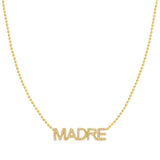 A Pavé 'Madre' Necklace in yellow gold on a bead chain on a white background.