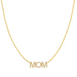 A Pavé MOM Necklace in yellow gold on a bead chain on a white background. 