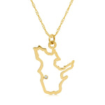 A Quebec pendant necklace in yellow gold with a diamond on a white background.