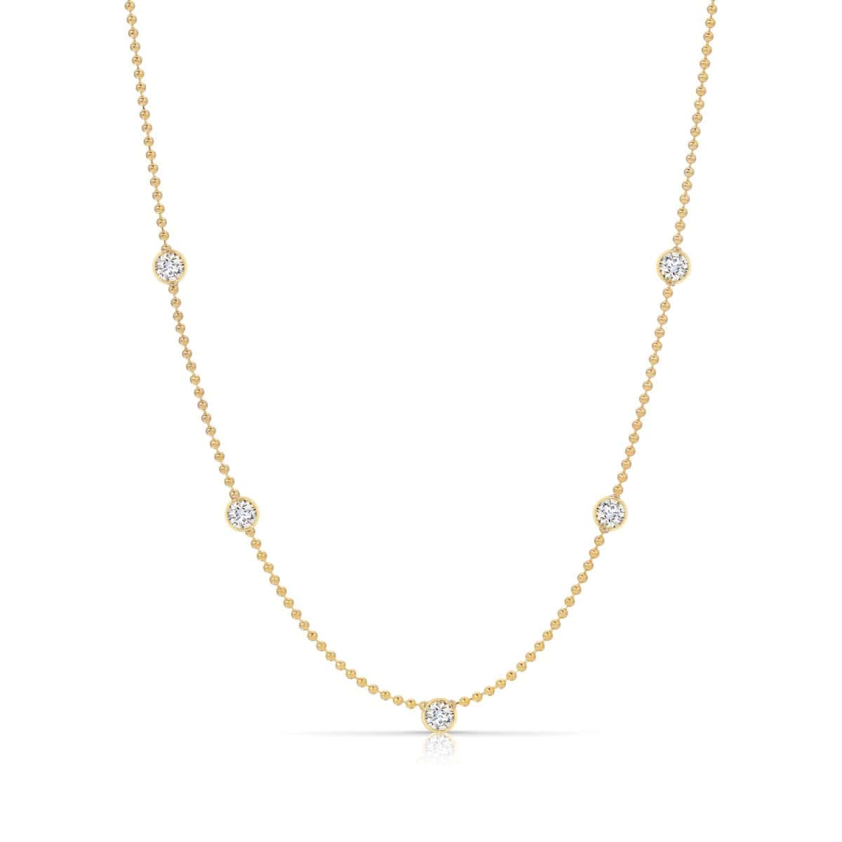 Quintet Diamond Layering Necklace in yellow gold on a white background. 