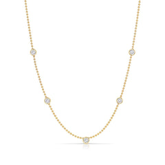 Quintet Diamond Layering Necklace in yellow gold on a white background. 
