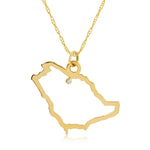 A Saudi Arabia pendant necklace in yellow gold with a diamond on a white background.
