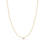 A Single Diamond Layering Necklace in yellow gold on a white background