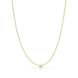 A Single Diamond Layering Necklace in yellow gold on a white background