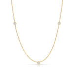 Triple Diamond Layering Necklace in yellow gold on a white background. 