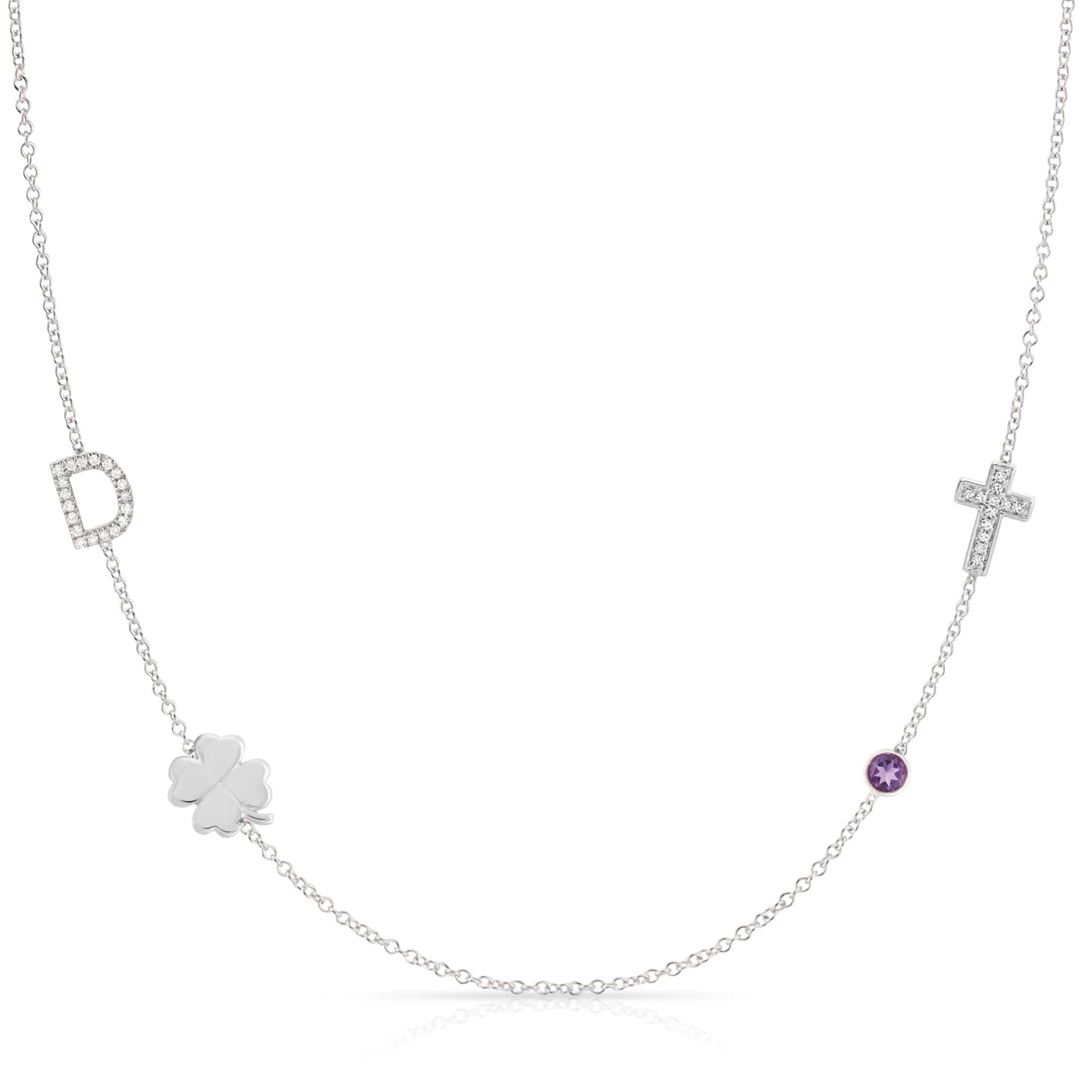 Necklace with various pendants including a clover, cross, and purple gemstone on a white background