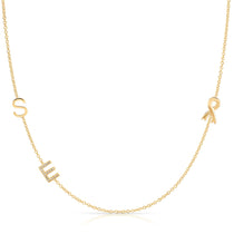 Gold necklace with 'SUE' pendant on a white background