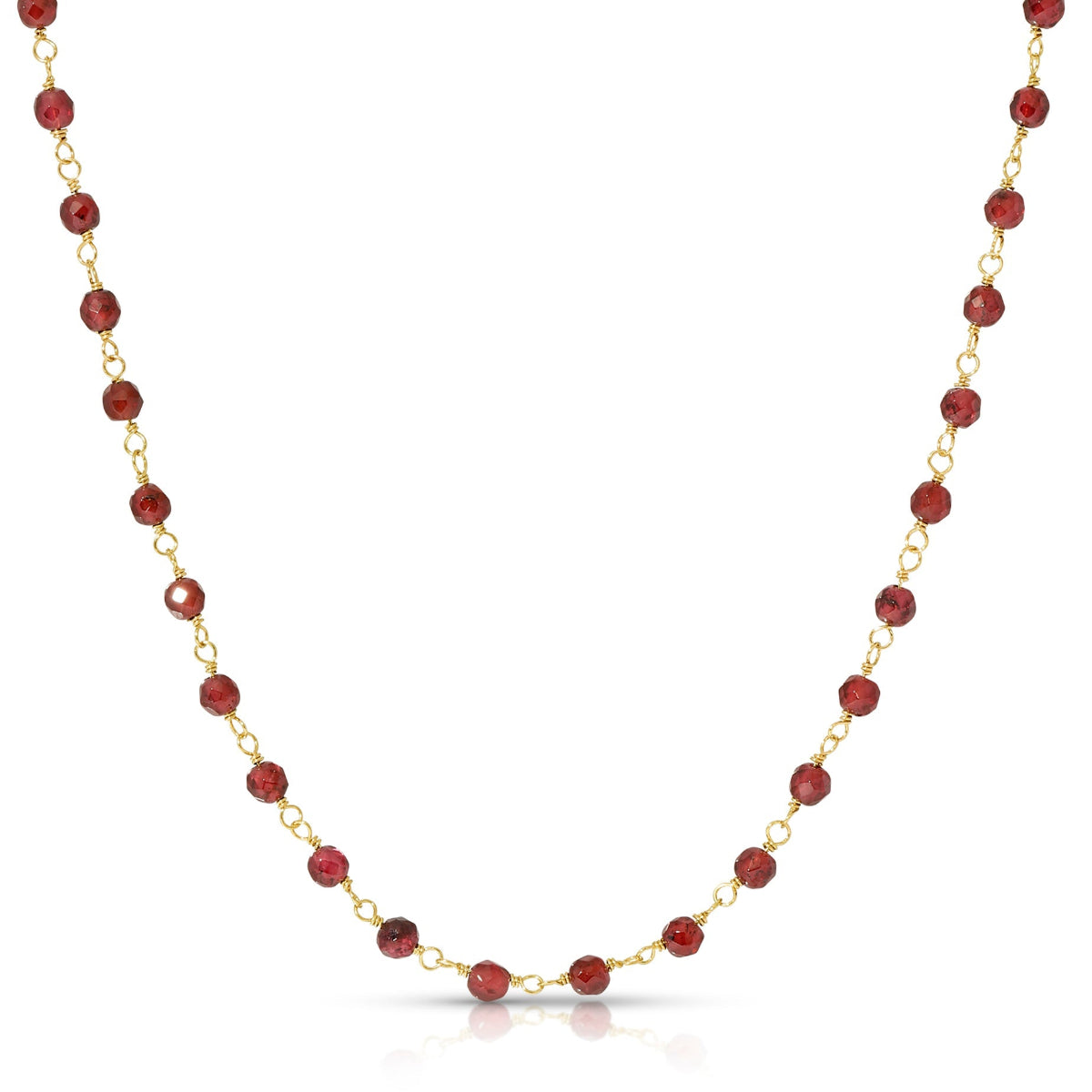 Necklace with red beads and gold chain on a white background