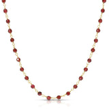 Necklace with red beads and gold chain on a white background