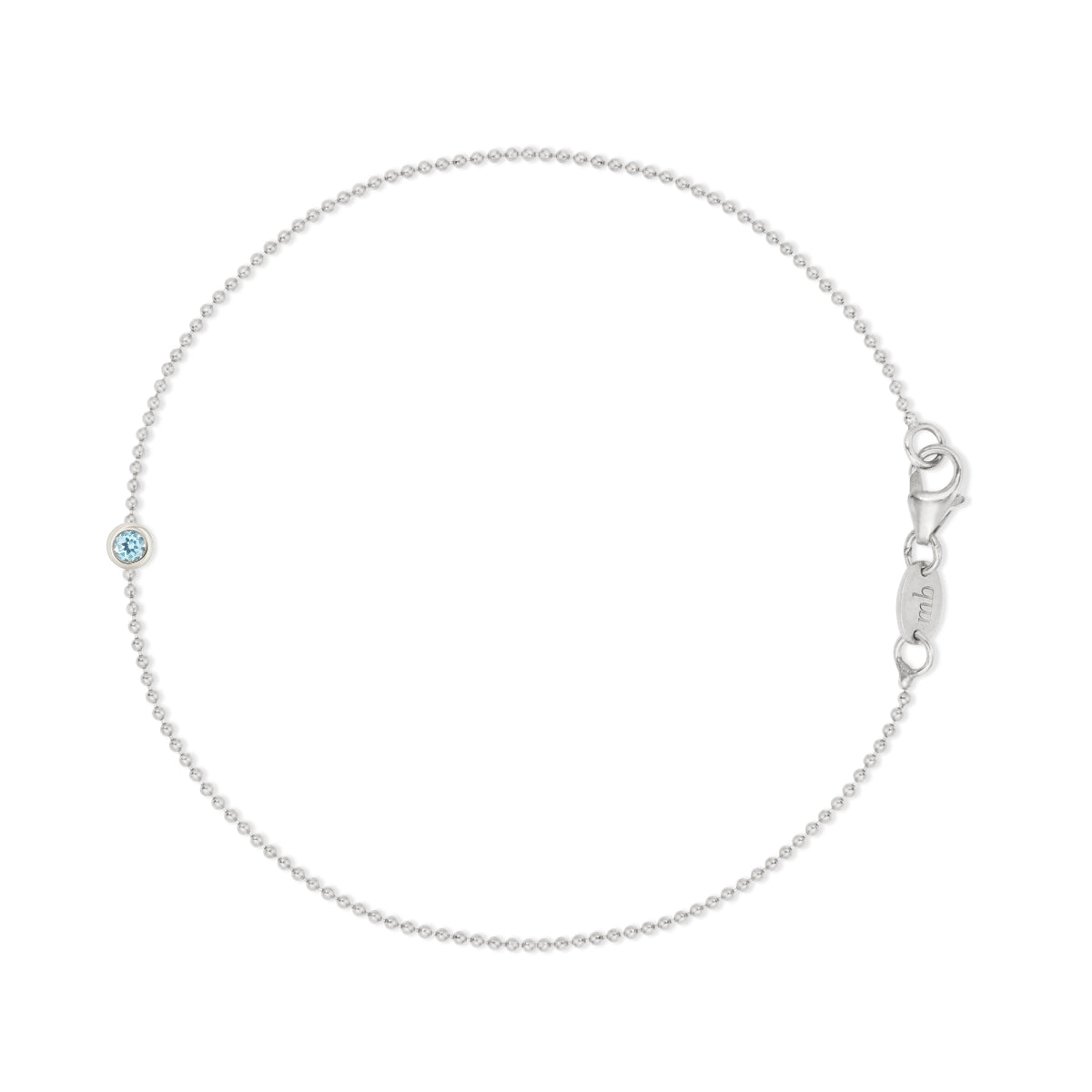 White gold bracelet with a tanzanite gemstone on a white background