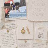 Inspiration board with jewelry, quotes, and photos on a textured surface