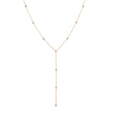 A gold Y-shaped lariat necklace with multiple small diamonds along the chain, displayed against a white background.