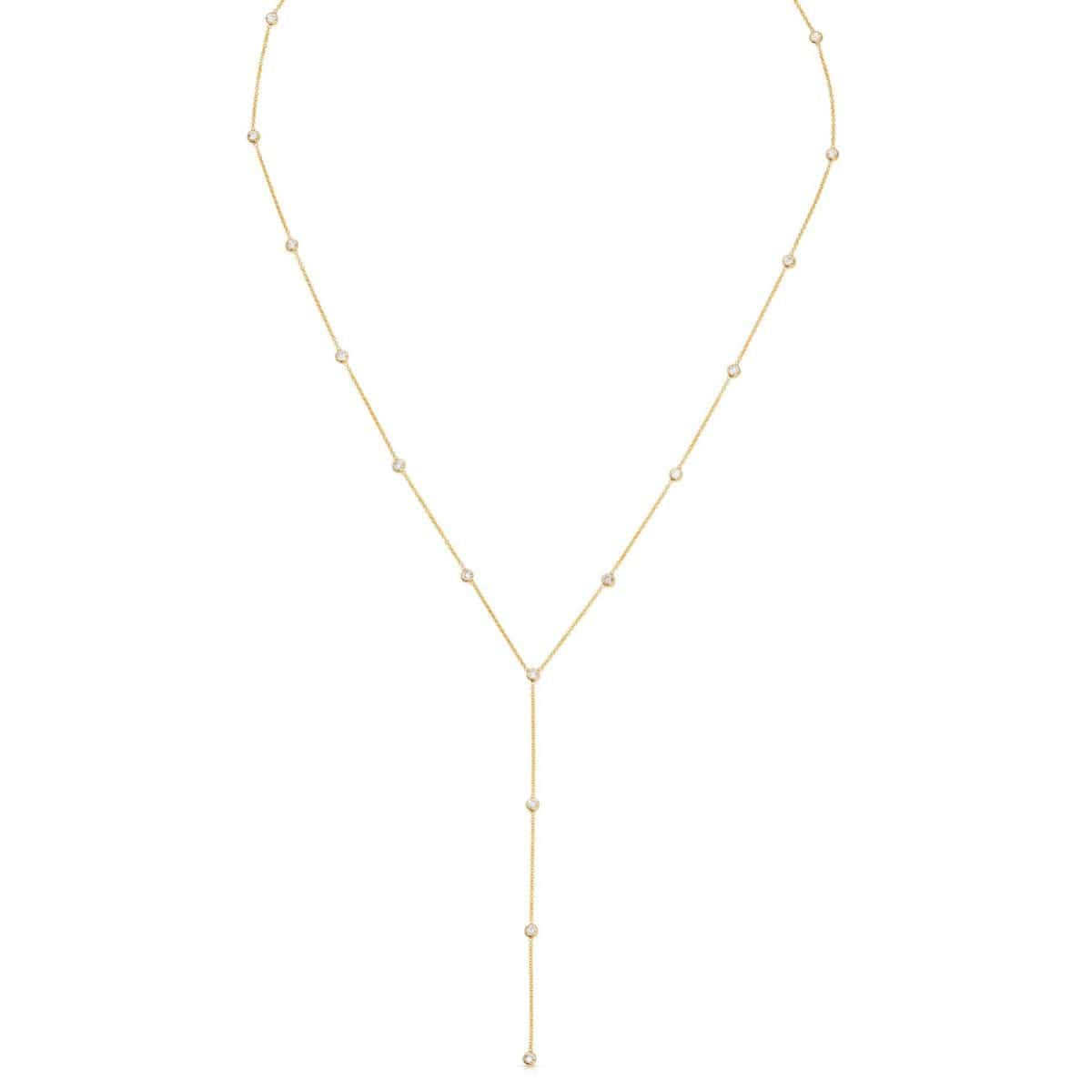 A gold Y-shaped lariat necklace with multiple small diamonds along the chain, displayed against a white background.