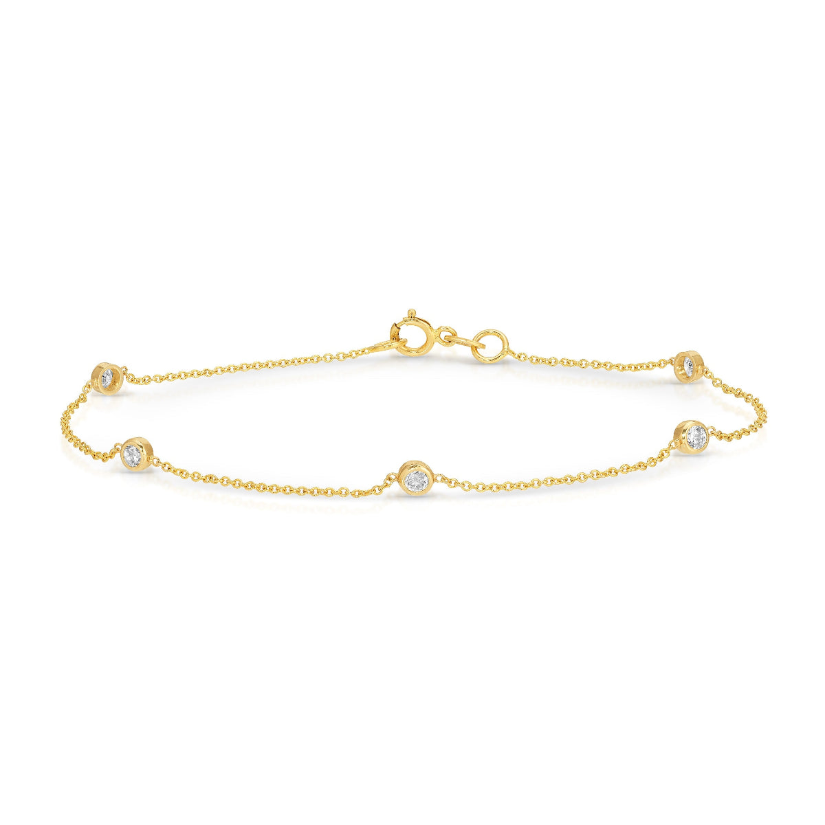 A delicate gold bracelet with five diamond accents, displayed against a white background.