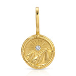 Gold pendant with a diamond on a white background