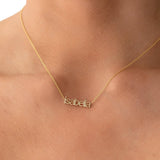 petite nameplate necklace in lowercase letters 'isabella' on gold chain