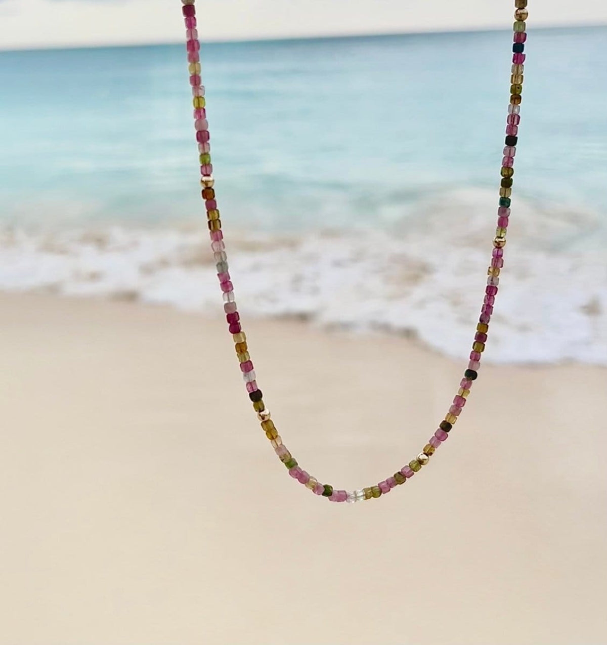 An Endless Summer Necklace - Coral Reef with the beach as a background. 