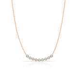 A Birthstone Arc Layering Necklace – Rose Gold in Aquamarine – March on a white background.