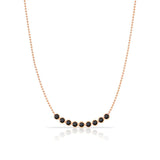 A Birthstone Arc Layering Necklace – Rose Gold in Onyx – August on a white background.
