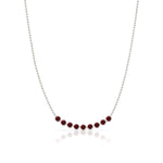 A Birthstone Arc Layering Necklace – White Gold in Garnet – January on a white background.