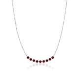 A Birthstone Arc Layering Necklace – White Gold in Garnet – January on a white background.