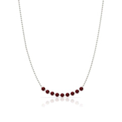 A Birthstone Arc Layering Necklace – White Gold in Garnet – January on a white background.